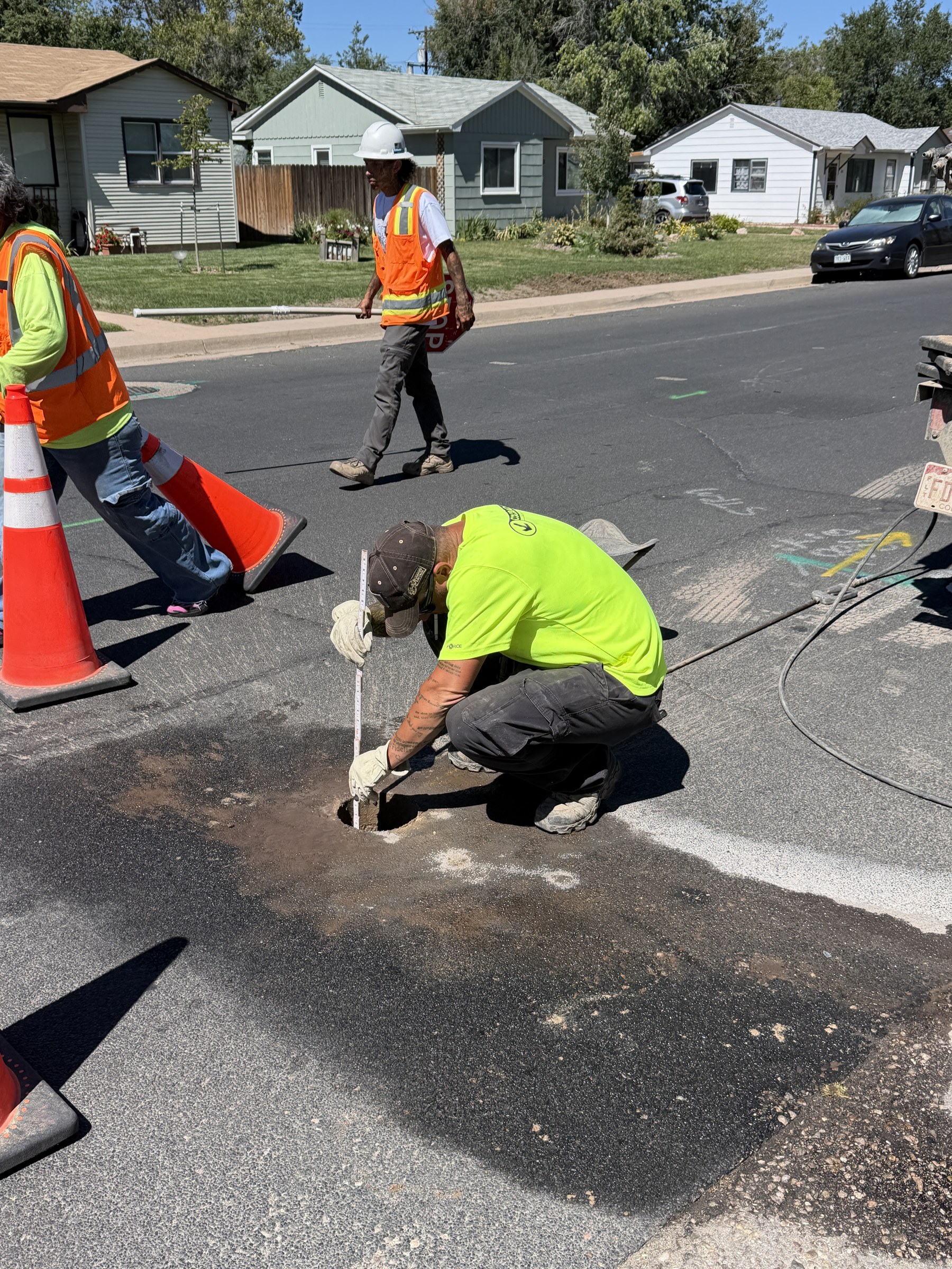 Documenting utility depth and material at an open pothole