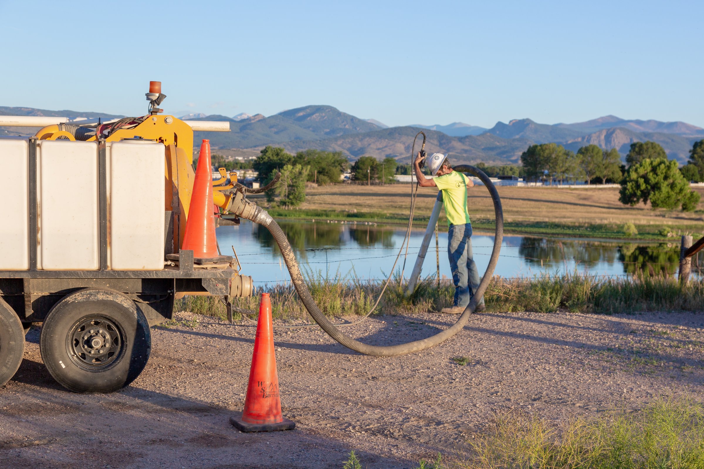 Hydro-excavation exposing utilities in an open test hole