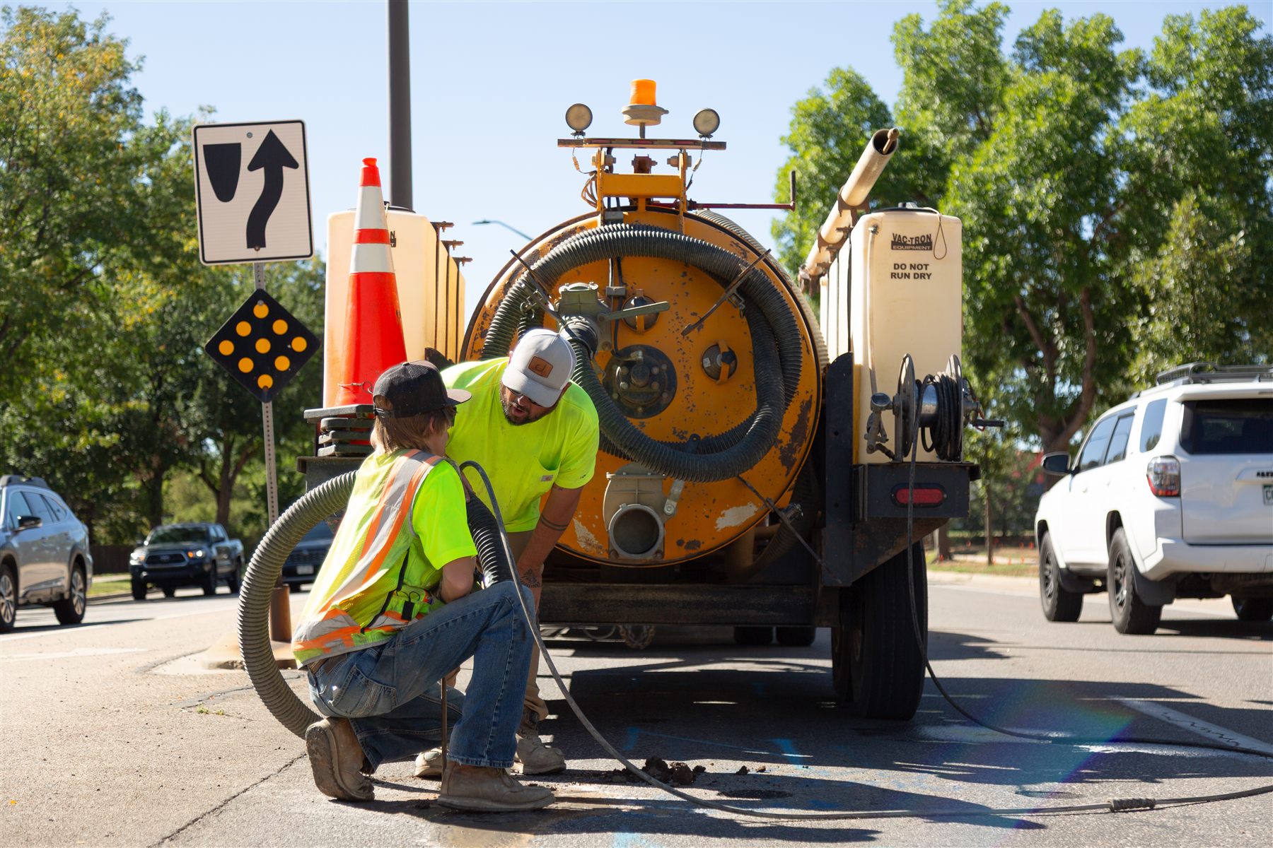 Open pothole exposing utilities